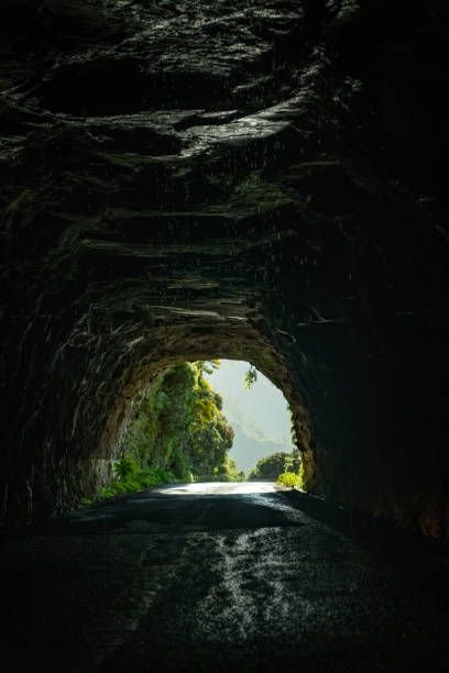 istock Light at the end of a dark tunnel or a cave 1496377341