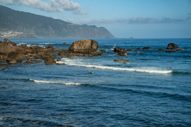 istock Blue sea waves crashing against the beach cliffs 1496377380
