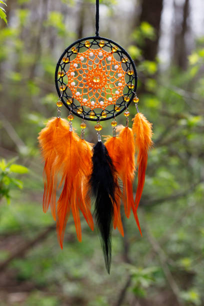 istock Handmade dream catcher with feathers threads and beads rope hanging 1496377977