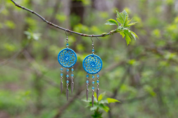 istock earrings of Handmade dream catcher with feathers threads and beads rope hanging 1496378033