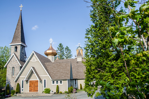 Multi religious chapel showing the different religious symbols on the roof: Catholic, Anglican, Muslim, Jewish, Protestant, Orthodox. This chapel is in PontBriand, Quebec.