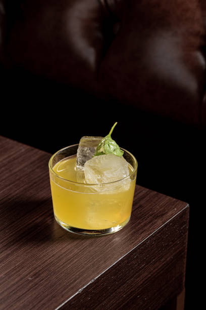 istock Luxury cocktail on the wooden table on a dark background 1496381394
