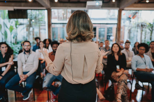 istock Woman presenting at a conference 1496383069