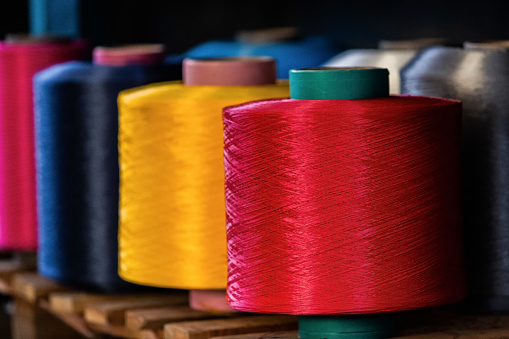 A Collection of sewing thread spools with threads of all colors