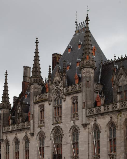 istock two old style clock towers with a clock tower at the front 1496383720