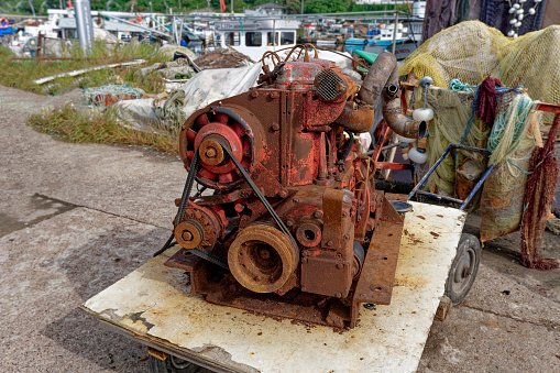 Viejo motor de barco pescador listo para reparar photo