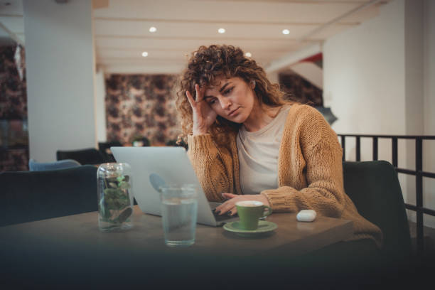 istock A young female freelancer who is visibly tired and nervous from too much work. 1496390360