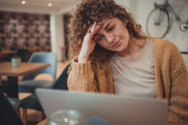 istock A young female freelancer who is visibly tired and nervous from too much work. 1496390852