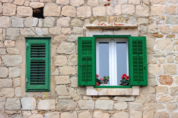 Picturesque windows on traditional old Mediterranean house in Split, Croatia.