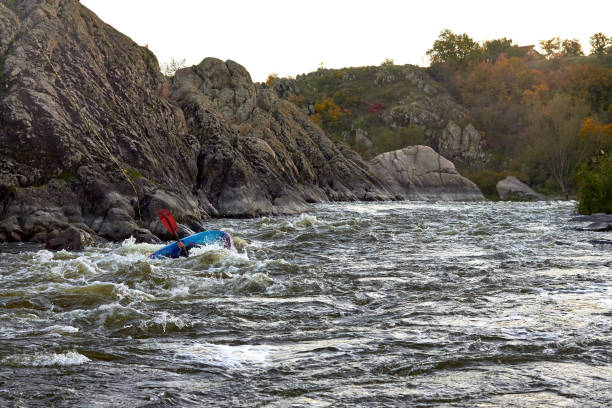 istock Overturn (capsize) man in kayak in whitewater river 1496393509