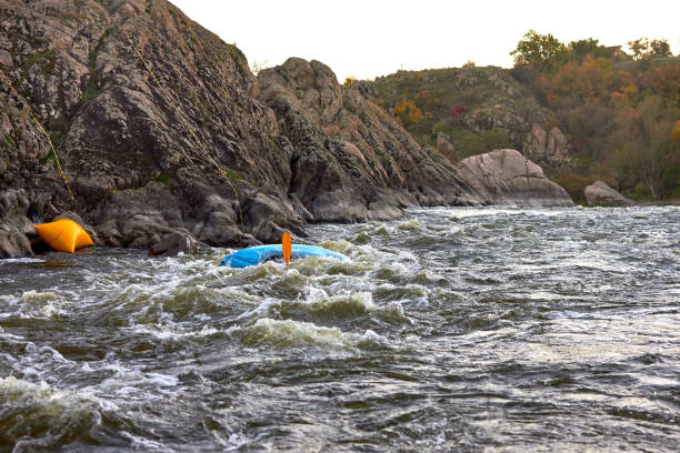 istock Overturn (capsize) man in kayak in whitewater river 1496393519
