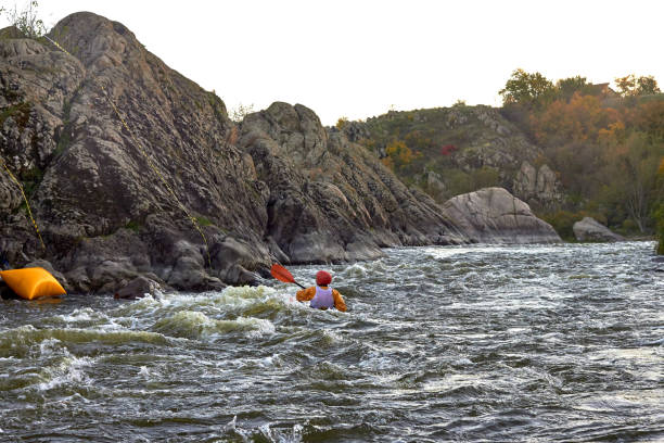 istock Kayak freestyle on whitewater on fast mountain river among the rapids. Whitewater kayaking, extreme water sport. 1496393641