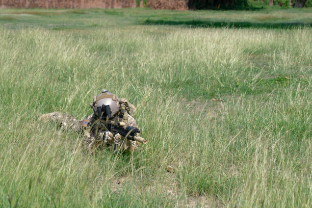 Soldier in civil war, ruined building. Close quarter battle and civil war concept.