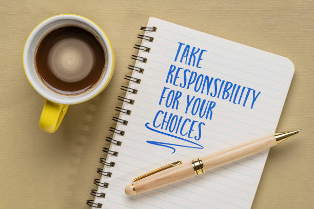 istock take responsibility for your choices - motivational writing in a spiral notebook, personal development concept 1496400836