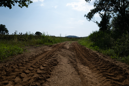 Country road with tractor tracks