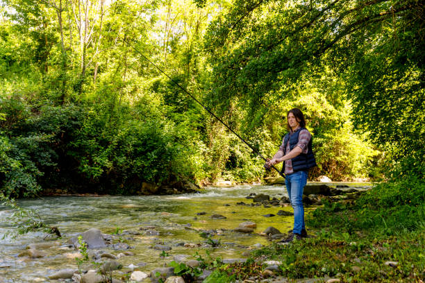 istock A young man is fishing along a creek 1496405914