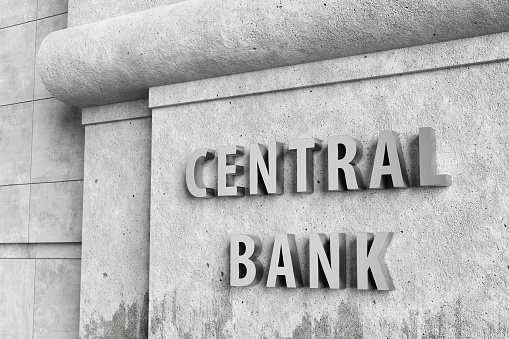 Shiny silver signage of central bank on vintage concrete wall. Illustration of the concept of monetary policy and federal reserve