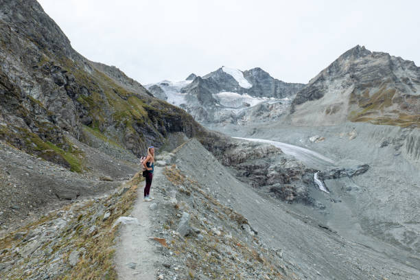 istock Female hiker looking at the beautiful panorama, glacier view 1496407102