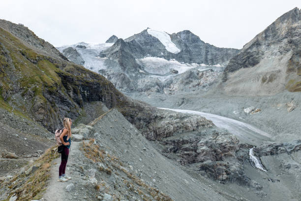 istock Female hiker looking at the beautiful panorama, glacier view 1496407106