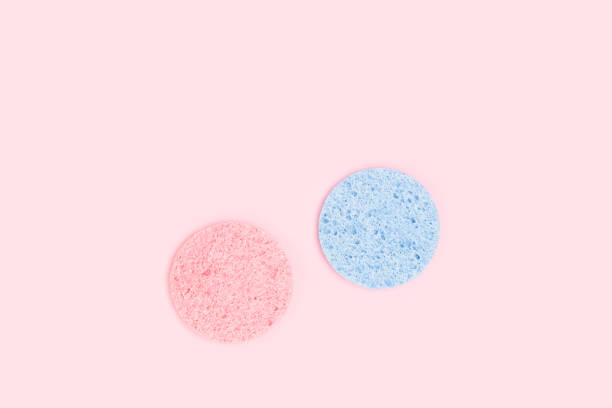 istock Face wash sponges on a pink background. 1496410995