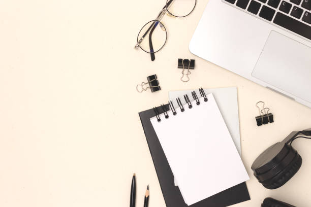 istock Layout with laptop, eyeglasses and stationery on a beige background. 1496411858