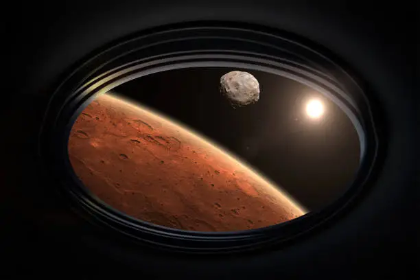 View from porthole of a spaceship to Mars with its moon Phobos. Phobos is the natural satellite of Mars. Expedition and colonization of Mars. Science fiction wallpaper. Elements of this image furnished by NASA. ______ Url(s): https://www.nasa.gov/multimedia/imagegallery/image_feature_1378.html
https://visibleearth.nasa.gov/images/147709/new-year-new-horizon/147711l https://photojournal.jpl.nasa.gov/catalog/PIA10368