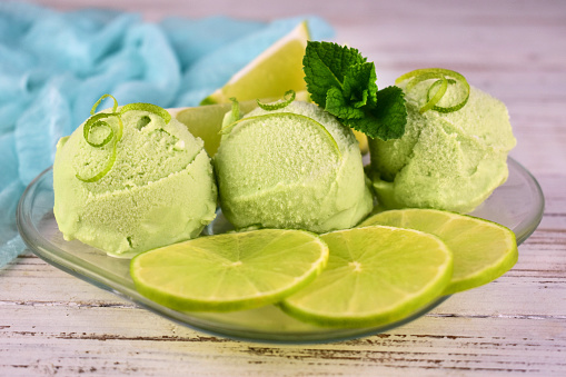 Ice cream with lime on a plate close-up.