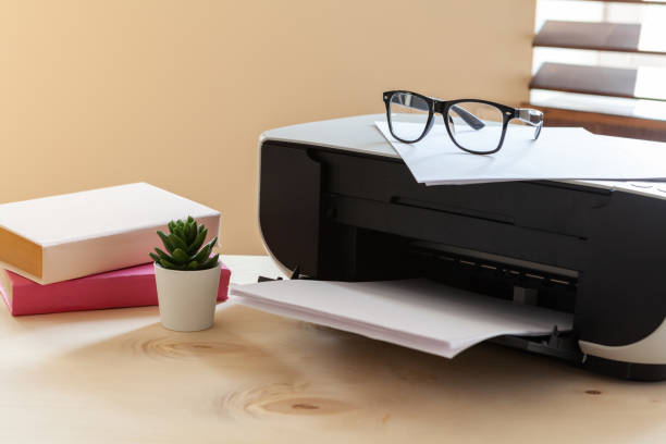 istock Close up of an office table with printer on it 1496415481