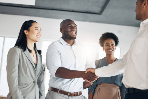 istock B2b, black man or manager shaking hands in meeting or startup project partnership or business deal. Teamwork, office handshake or happy worker talking or speaking of success or hiring agreement 1496415700