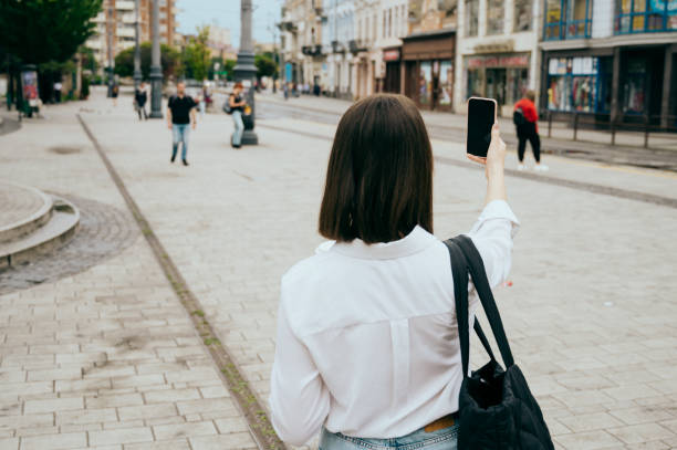istock young woman going to work, city street 1496417799