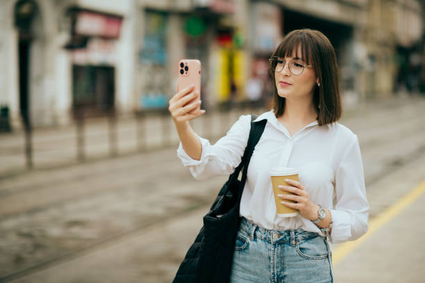 istock young woman going to work, city street 1496417800