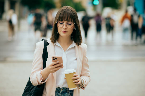 istock young woman going to work, city street 1496417819