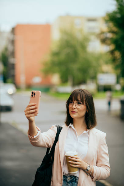 istock young woman going to work, city street 1496417852