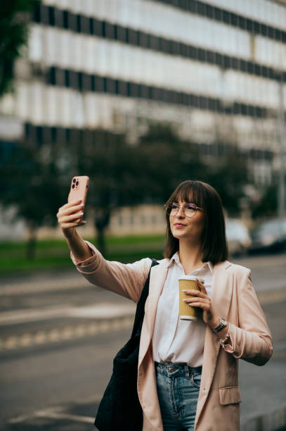istock young woman going to work, city street 1496417875