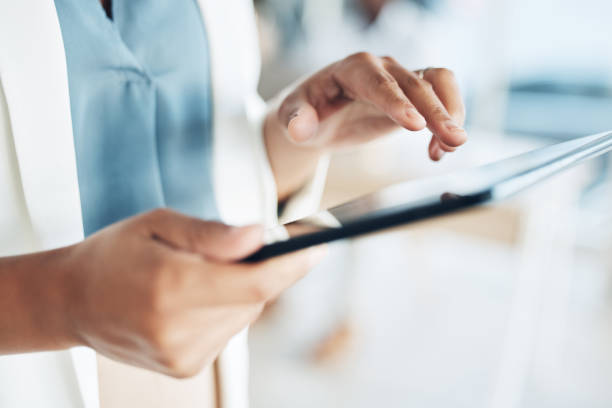 istock Tablet, search and hands of woman in office for networking, information and project analysis. Executive, technology and digital with zoom of female browsing online for app, email and connection 1496419076