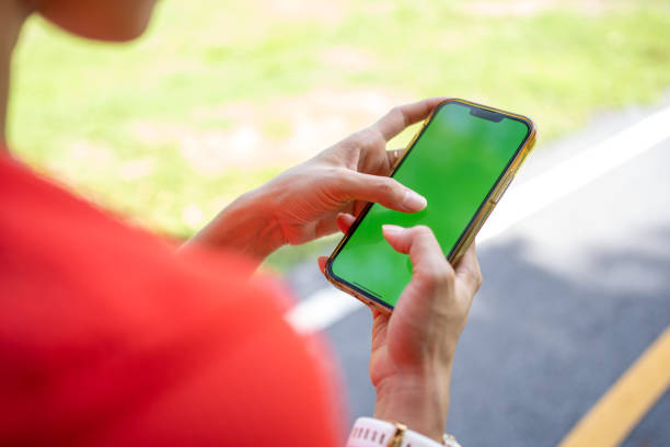 istock Sport woman in red shirt using mobile phone. 1496420923