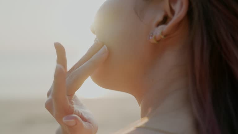 Women protect her skin from UV while summer vacation.