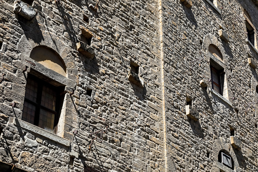 old window of castle and tree outside