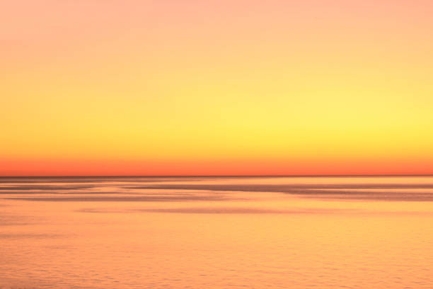 Orange and yellow morning over calm ocean