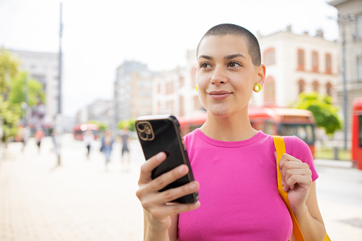 Portrait of a young woman using smartphone