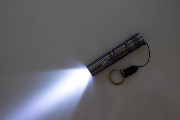 istock a beam of light from a portable flashlight on a gray background, copy space 1496431772