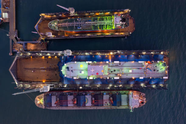 istock Dry dock with Cargo Ship maintenance or repair at floating dock in shipyard both deck crane loading during bring ship in to the dry dock. 1496435572