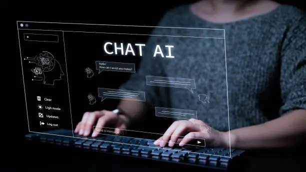 Photo of Woman using a computer chatting with an intelligent artificial intelligence asks for the answers he wants. A.I. Chat with AI or Artificial Intelligence technology. Smart assistant, AI to help work,