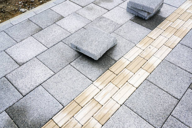 istock Recently paved gray sidewalk with guidelines for the visually impaired persons, tactile paving 1496438921