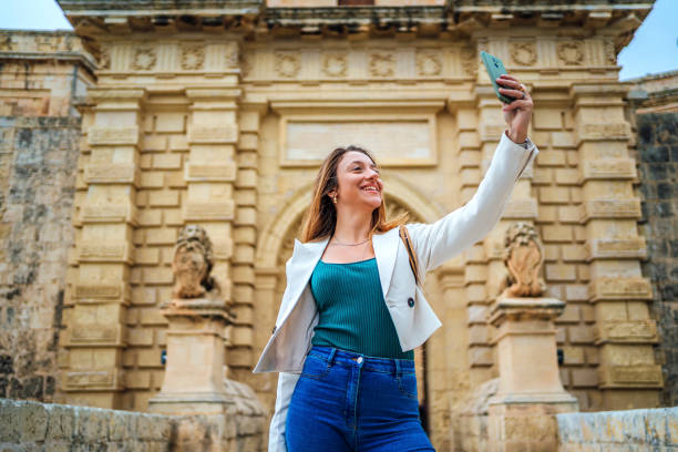 istock Young woman taking selfies in Mdina, Malta 1496439359