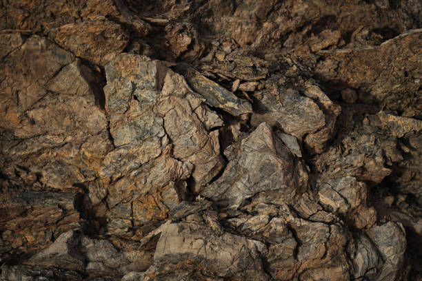 istock Brown red orange rock texture. Mountain. Close-up. Collapse, cracked, crumbled, crushed. 3d shape. Stone basalt background. 1496439383