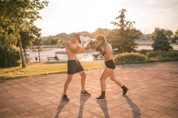 istock Two fighters in love training kickboxing in the park 1496441915