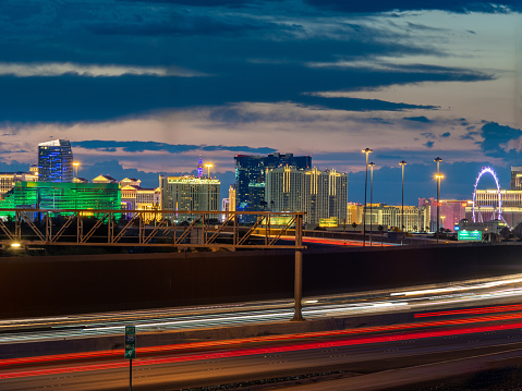 Las Vegas skyline at dusk with local freeway traffic