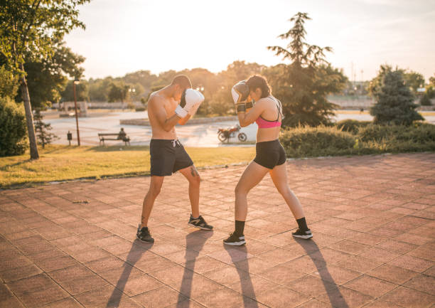 istock Two young fighters training kickboxing in the park 1496443889