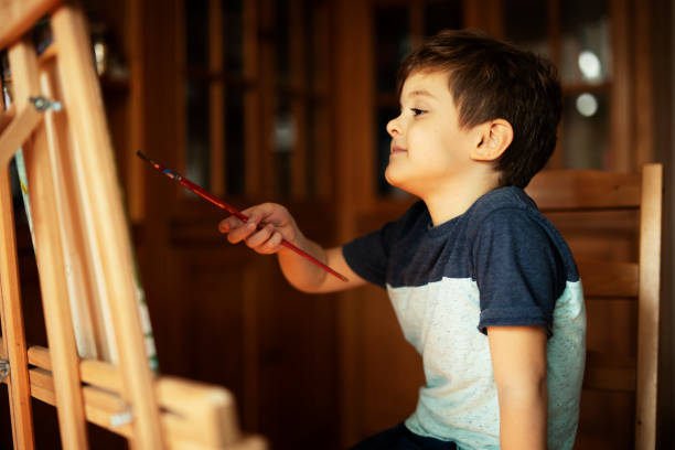 istock Little boy drawing in living room 1496444747